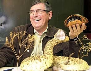 herpetologist Dr. Pauley with a snake and a turtle